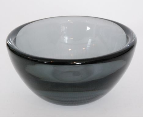 A post war Orrefors Kraka glass bowl designed by Sven Palmqvist of circular section with heavy cased wall internally decorate