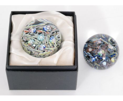 A limited edition Caithness paperweight titled Glassmaker decorated with themed millefiori canes with glassmakers tools over 