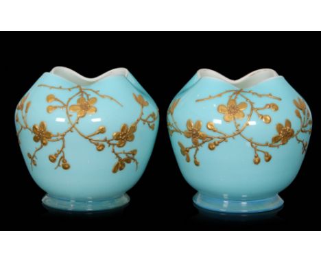 A pair of late 19th Century Edward Webb posy vases of footed ovoid form, cased in blue over opal with quatrelobed rims, relie