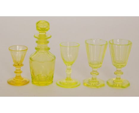 A 19th Century miniature uranium glass decanter of shouldered form with basal and shoulder slice cut decoration below a two r