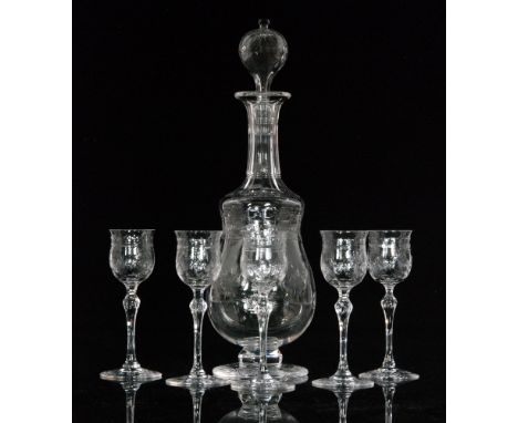 An early 20th Century Stuart & Sons liqueur decanter of footed double gourd form with a slender slice cut neck and hollow blo