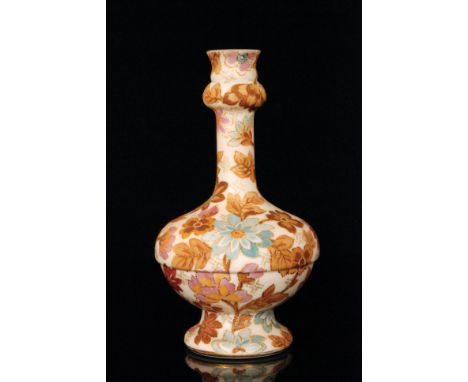 A late 19th Century Harrach vase of footed compressed ovoid form with tall slender collar neck with upper knop, enamel decora