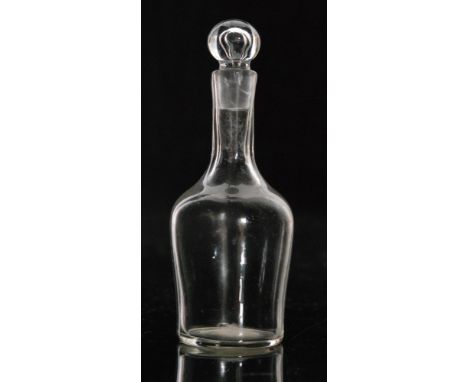A late 18th Century miniature magnum decanter of shouldered ovoid form with slender collar neck and hollow blown ball stopper