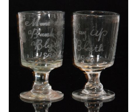 A pair of late 19th Century disaster glasses with bucket form bowls above capstan stems and a circular spread foot, each engr