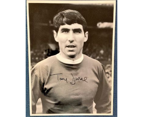 Tony Dunne signed 16x12 black and white photo pictured during his playing days with Manchester United. Anthony Peter Dunne (2