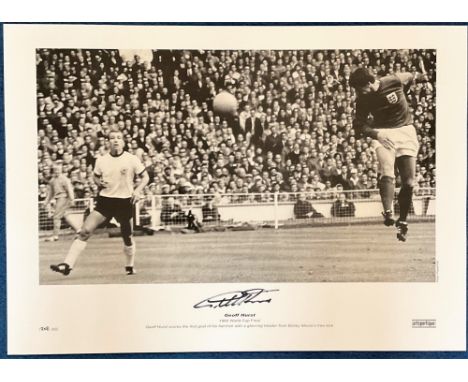 Geoff Hurst signed 23x17 black and white print pictured scoring the first goal of his hat trick during the 1966 world cup fin