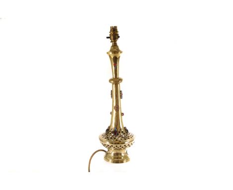 A pretty brass and jewelled Middle Eastern table lamp, the slender body having multiple applied jewel decoration, with pierce