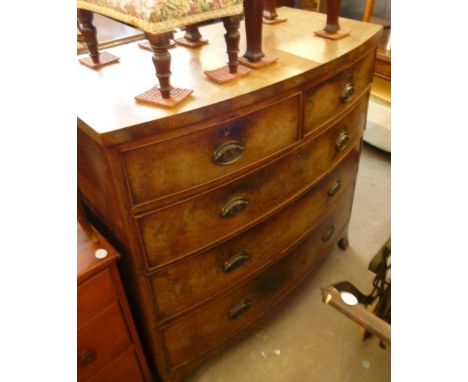 A Georgian bow fronted chest,  two over three drawers on splay bracket feet 106cm W 