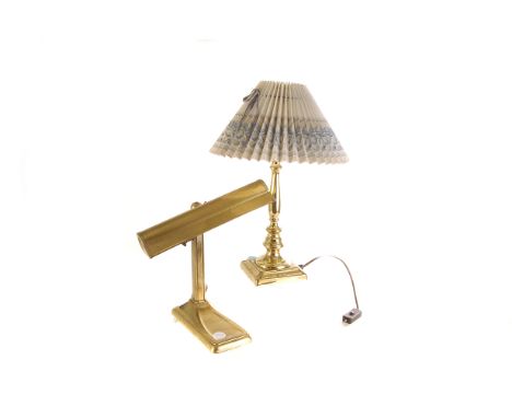 A brass Christopher Wray lamp, together with another brass desk lamp (2) 