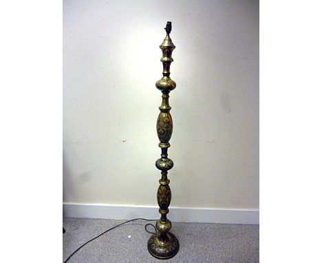 A Middle Eastern brass and Champlevé enamel standard lamp, having repetitive design up the slender body, approx. 154cm H 