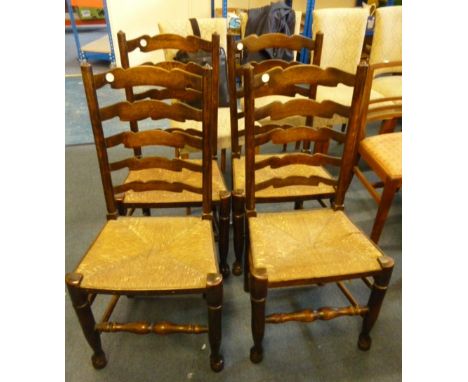 A set of four ladder back country kitchen chairs,  with rush seats (4) 