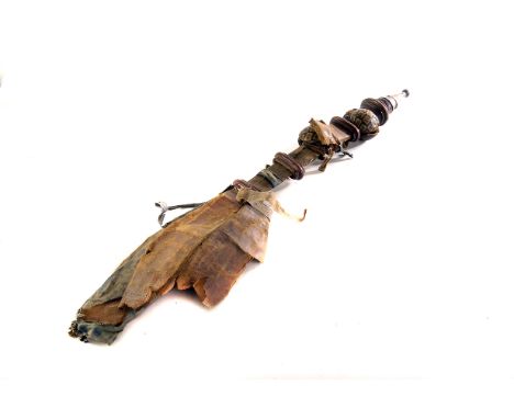 A North African sabre,  with single off centre three quarter length fuller, the leather covered wooden scabbard with tooled l