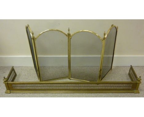 A 20th century brass hearth fender,  with pierced and bead decoration, 133cm long, together with a collection of brass fire-s
