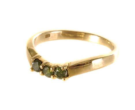 A 9ct gold green diamond three stone ring, the three round cut diamonds set in a 9ct gold band, size N1/2, approx. 2.2g 