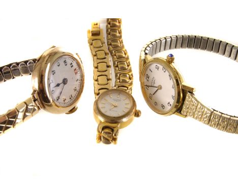 An early 20th century 9ct gold wristwatch by Buren Watch Co.,  with white enamel dial, black Arabic numerals (red 12), signed