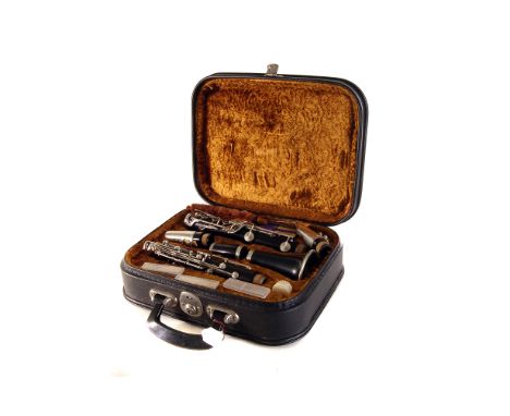 A Vandoren clarinet, in a fitted faux-fur lined Corton case, together with additional reeds and mouth piece  