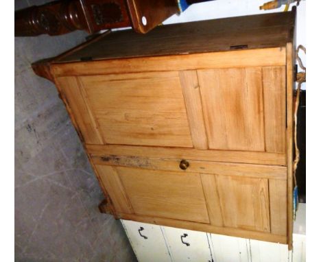 An unusual 19th century pine two door cupboard, with hinged lid, and on bracket feet 121cm H 