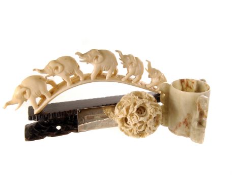 A collection of decorative ivory items, to include a puzzle ball, napkin rings, a page turner, AF, and more (parcel) 