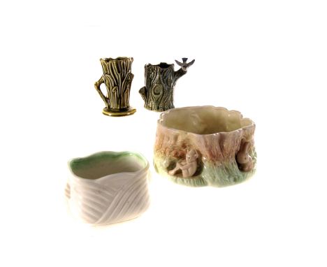 A small collection of ceramics,  including a pair of Wade tortoise, a small Wade vase, modelled as a tree trunk, and four pla