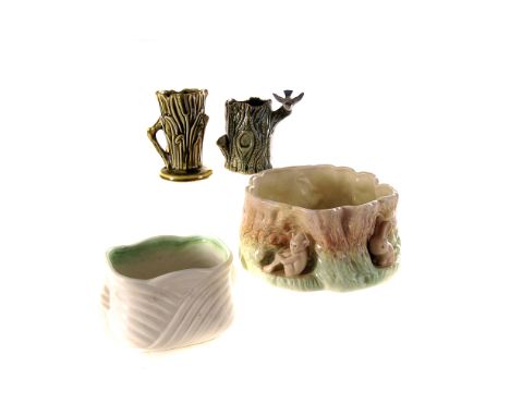 A small collection of ceramics,  including a pair of Wade tortoise, a small Wade vase, modelled as a tree trunk, and four pla