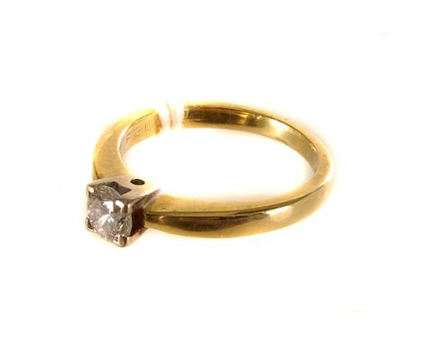 A single stone diamond ring,  the central brilliant cut .37 ct set in a four prong mount, the shank hallmarked 18ct yellow go