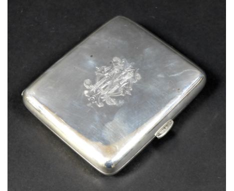 A late Victorian silver cigarette case, engraved to one side with an armorial crest 'Fac Et Spera' and monogram to the other,