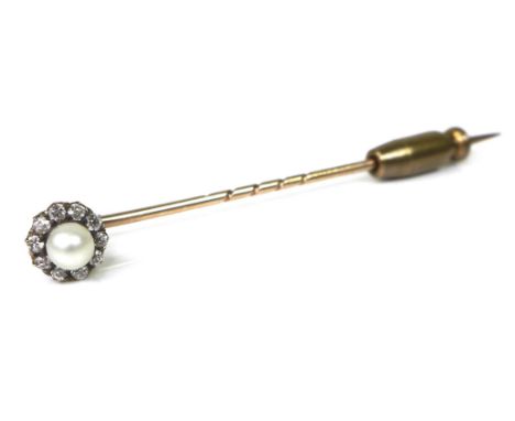 A yellow metal stick pin, the removable head set with a cultured pearl surrounded by ten diamonds, 6.5cm long, 3.5g, boxed. 