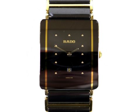 A Rado Diastar black ceramic and gold plated wristwatch, model 160.0282.3, serial 04989856, case 27 by 32mm, 71.4g, with box 