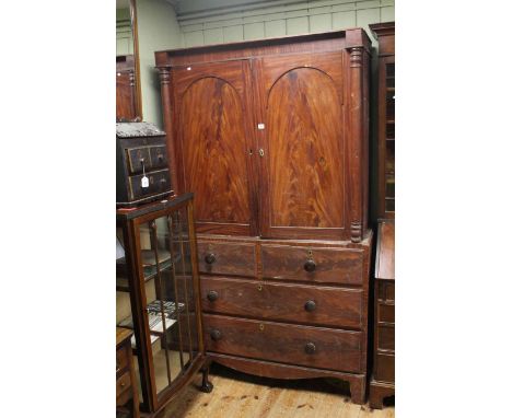 Victorian pine linen press having two doors with four drawers below on bracket feet, 204cm by 115cm