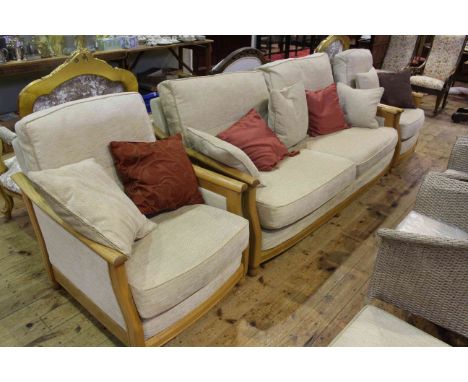 Ercol three piece lounge suite and footstool in light fabric