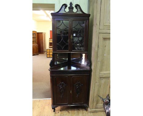 Late Victorian mahogany Chippendale style corner cabinet having two glazed panelled doors above two mirrored panels with two 