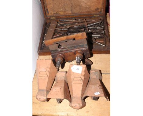 Vintage wood plane, drill bits and tools and four cast iron bath feet