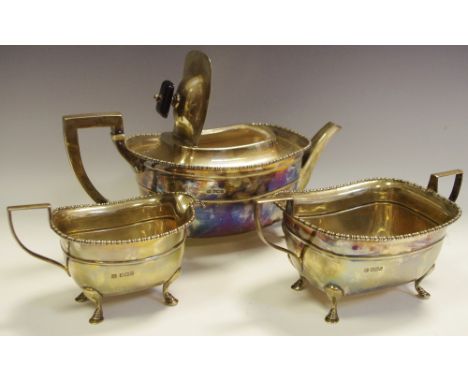 A silver three piece boat shaped tea service, Sheffield, 1912