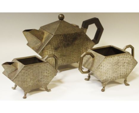 An Art Deco Tudric style pewter tea service comprising teapot, sucrier and creamer