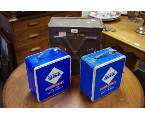 An ammunition case; two Camping Gaz stoves in tins (3)