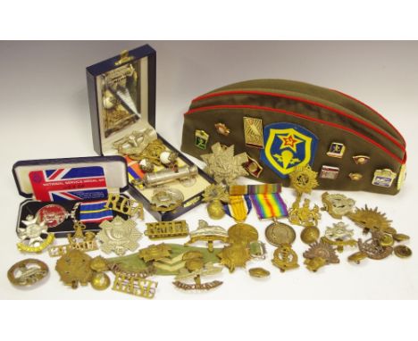Militaria - a WWI defence medal inscribed 12081 CPL . L . BARKER. LAN. FUS, another; various cap and lapel badges, etc; a rep
