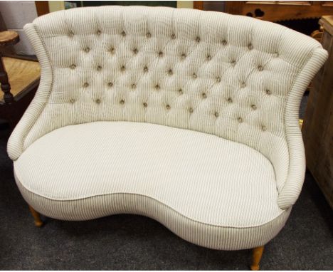 A button upholstered kidney shape two seat conversation seat