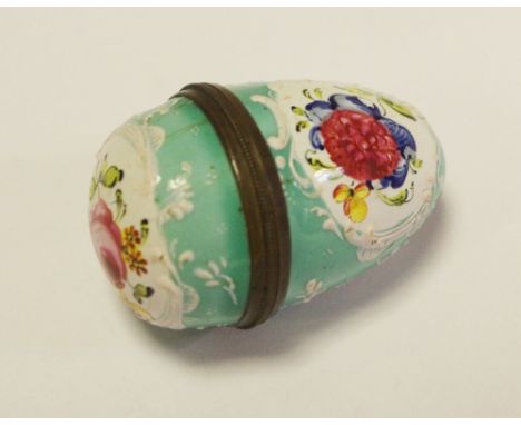 A 19th century Continental egg shaped enamel bonbonierre decorated with wild flower 
