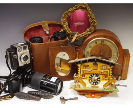 A cuckoo clock; a Westminster chime mantel clock; a Minolta 35mm camera with zoom lens; other cameras; a pair of Prinz binocu