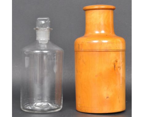A vintage 20th century olive wood cased apothecary bottle of cylindrical form having a screw top lid. Measures 17cm high.