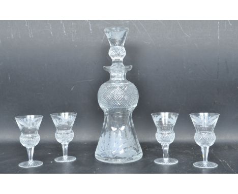 A vintage 20th century Edinburgh crystal glass Thistle pattern decanter together with four matching glasses. The stopper havi