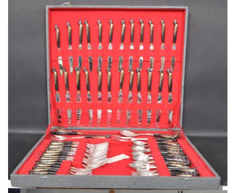 A vintage retro 20th century 12 place canteen of cutlery by S&amp;S Haddad Lebanon. The canteen cutlery having the wooden han