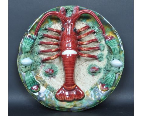 A vintage late 20th century Portuguese Palissy style lead glazed pottery dish modelled as a lobster having a polychrome decor