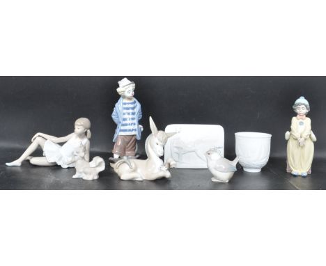 A collection of eight 20th century Spanish Lladro ceramic porcelain figurines to include: Clown ( Collectors Society 1986 ), 