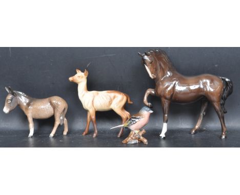 A group of four vintage 20th century ceramic porcelain Beswick figurines to include a &nbsp;Fawn - Doe model No. 999A designe