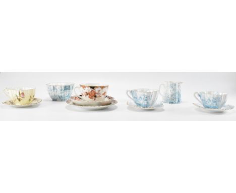 An assortment of 19th Century Victorian tea cups and saucers to include Wileman Dolly Varden pattern creamer jug, sugar bowl 