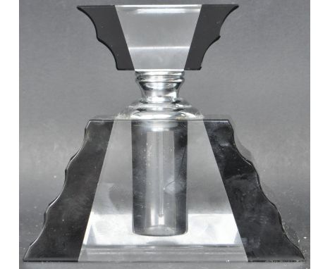 A vintage retro late 20th century glass perfume bottle. The perfume bottle having a two tone glass base of trapezoid form wit