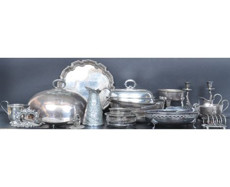 A collection of vintage 20th century silver plate comprising of meat covers / cloche, jug, wine coasters, tray, candlesticks 