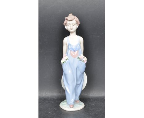 A ceramic porcelain Spanish Lladro Collectors Society 1997 figure entitled 'Pocket Full Of Wishes'. Figurine model number 765