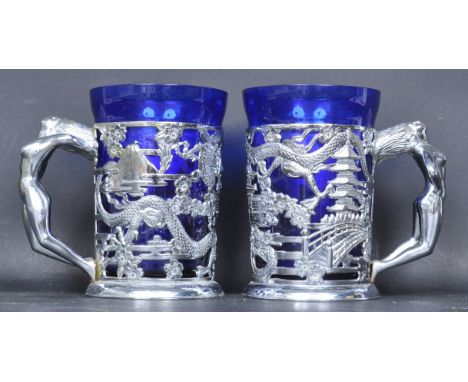 A pair of retro vintage mid 20th century circa 1950s Chinese white metal and cobalt blue glass goblets having a pierced frame